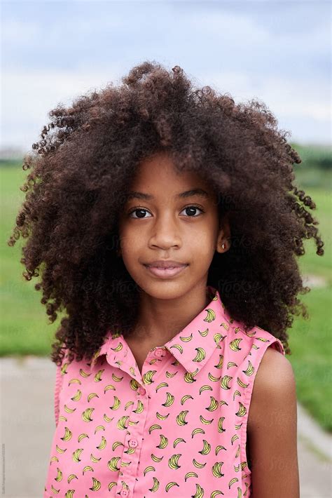 Young Girl With Curly Hair Portrait By Stocksy Contributor Guille Faingold Stocksy