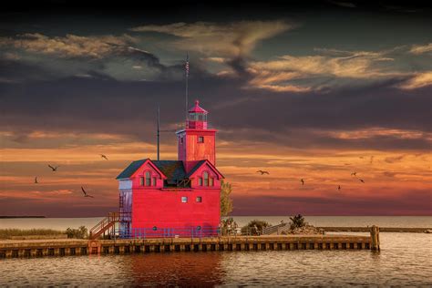 The Big Red Lighthouse At Sunset On Lake Michigan By Ottawa Beac