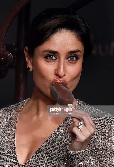 indian bollywood star kareena kapoor bites into an ice cream bar during it s launch at a high