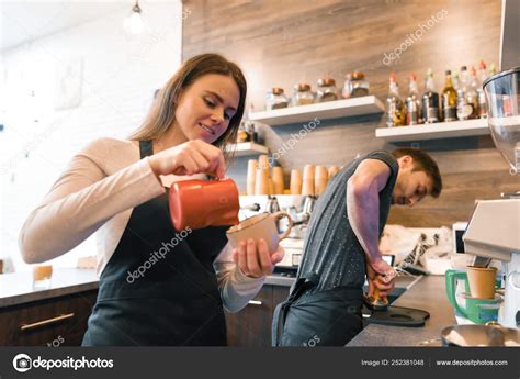 Coffee Shop Workers Young Smiling Man And Woman Making Coffee With