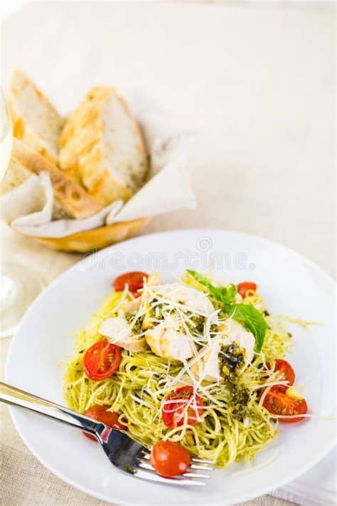 1 in a large pot prepare pasta according to directions, in the last minute of cooking add in the shaved carrots and then drain. Pasta with pesto stock photo. Image of making, cooking ...