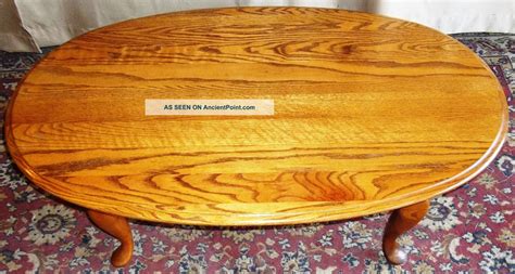 Swing out doors reveal an open cabinet for plenty of storage. Vintage Broyhill Oak Queen Anne Oval Coffee Table ...