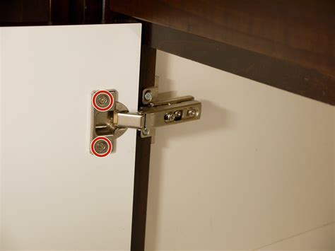 Place the old hinges aside. How to Replace Concealed Cabinet Hinges - iFixit Repair Guide