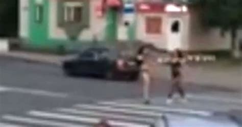 Watch As Driver Distracted By Scantily Clad Prostitutes Crashes Car