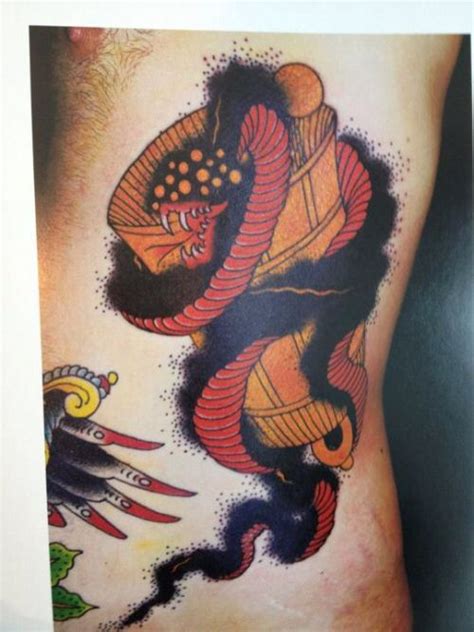 Twitter reacts to grimes' alien tattoo. smoke snake and bell tattoo by Grime. literally been ...