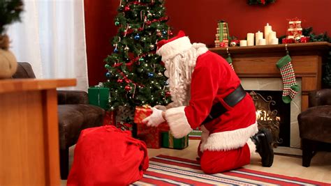 santa clause putting ts under the tree stock footage video 2343458 shutterstock