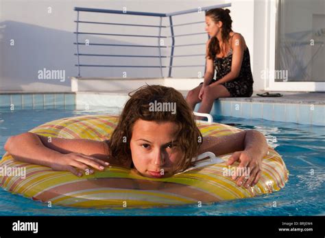 Girl With Flotation Device In Swimming Pool Stock Photo Alamy
