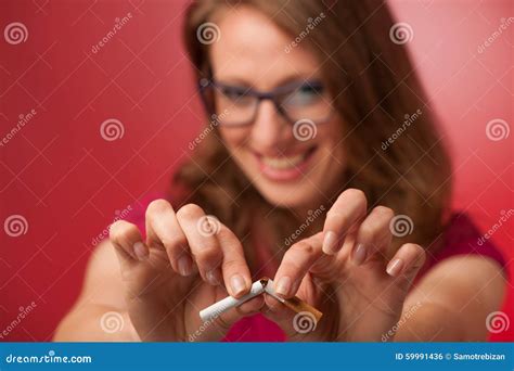 Beautiful Young Woman Breaks A Cigarette As A Gesture For Quit S Stock