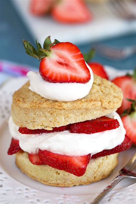 Strawberry Shortcakes With Whipped Cream And Strawberries On A White