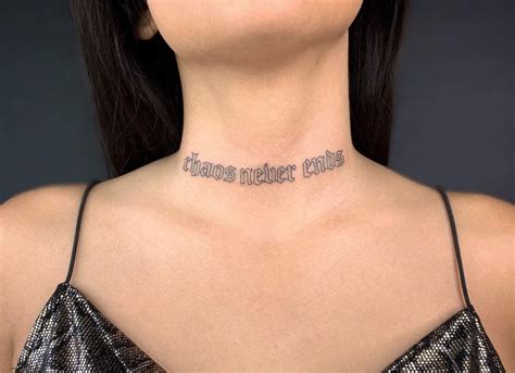 a woman wearing a necklace with words written on the back of her neck and chest