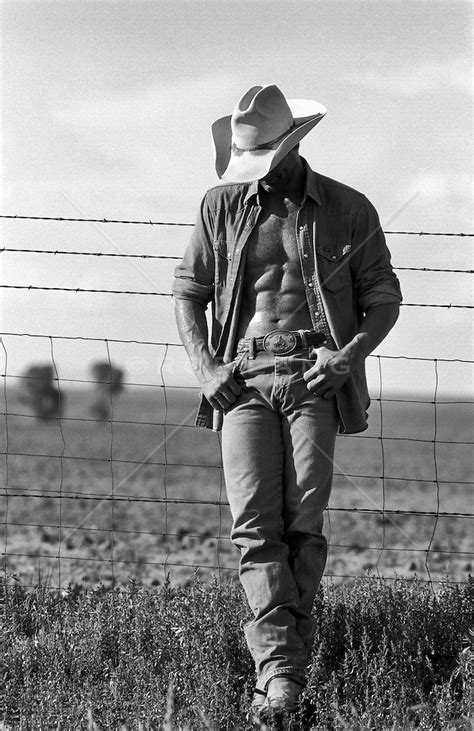 Very Sexy Cowbabe With An Open Shirt Leaning On A Fence In New Mexico ROB LANG IMAGES