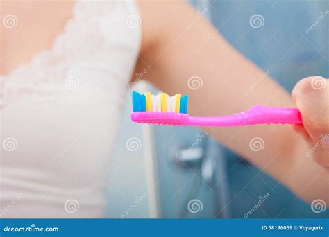 Woman Hand Holding Toothbrush In Bathroom Stock Image Image Of
