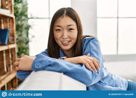 Young Chinese Girl Smiling Happy Sitting On The Sofa At Home Stock Image Image Of China House