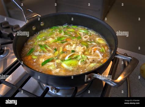 Vegetable Soup Simmering In Pan On Hob Stock Photo Alamy