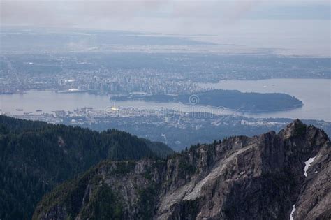 Aerial View Of Grouse Mountain With Downtown City In The Background