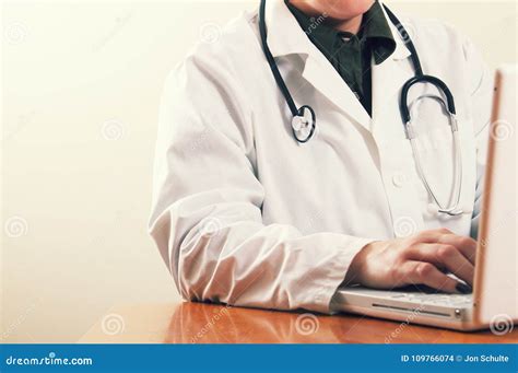 A Doctor Using A Computer Laptop Stock Photo Image Of Care Records