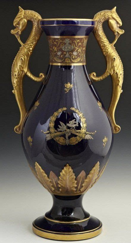 A Blue Vase With Gold Dragon Decorations On The Top And Bottom In