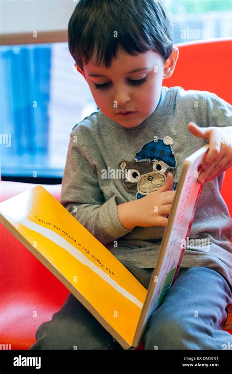 Boy Reading Book Stock Photo Alamy