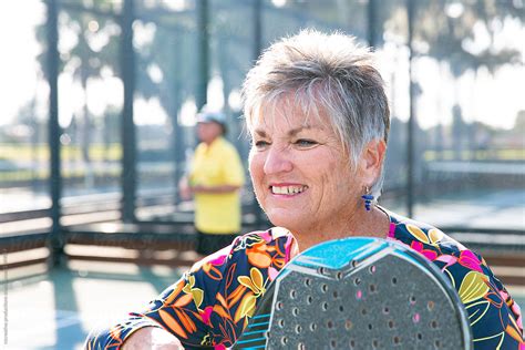 Portrait Of Older Woman On Tennis Court By Stocksy Contributor