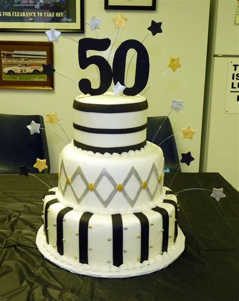 No celebration is complete without a dog birthday cake! 50th birthday cake ideas | Black, silver and gold 50th ...