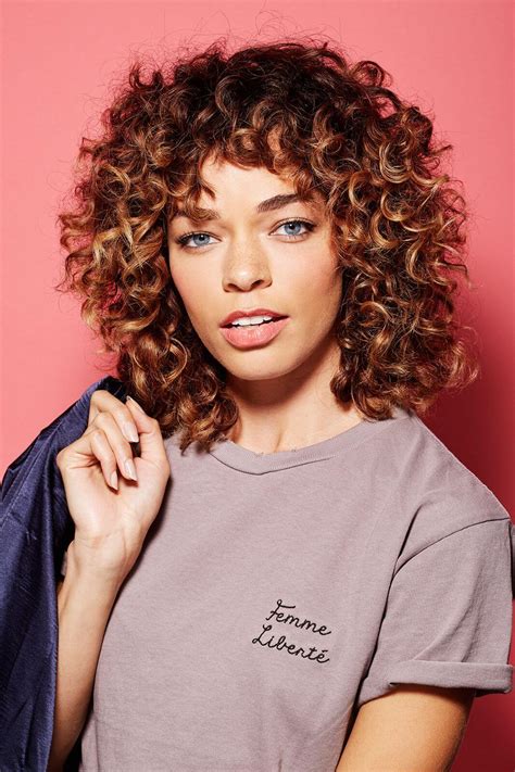 Flaunt Your Curls With These Curly Hairstyles With Bangs