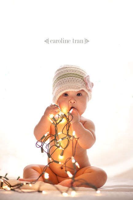 This Baby Playing With The Lights Baby Christmas Photos Toddler
