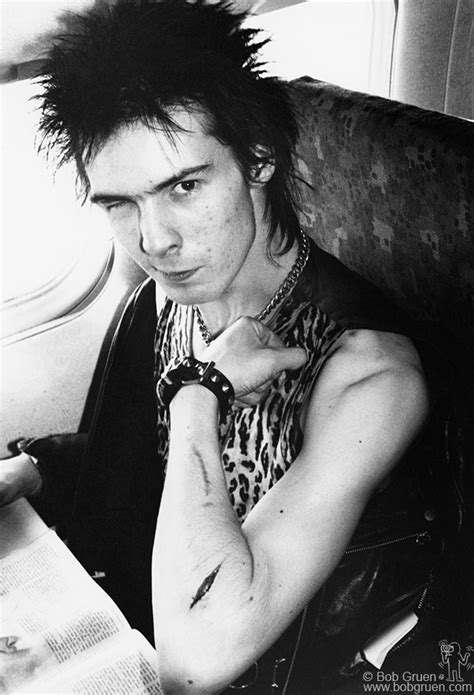 sid vicious of the sex pistols with cut arm on plane during us tour january 1978 image r