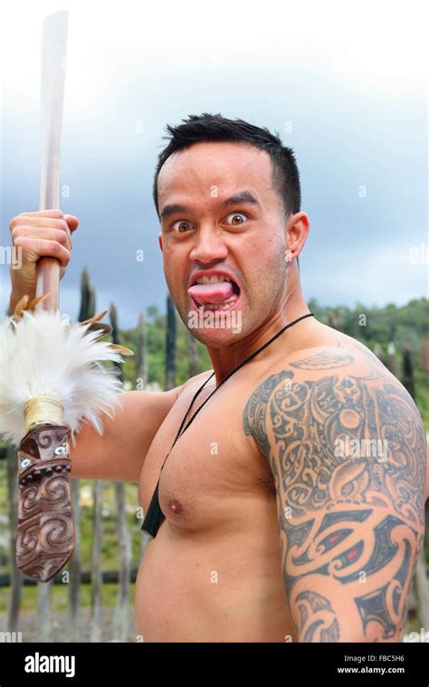 Maori Male Reproducing Part Of The Maori Challenge Haka With A Spear At The Te Puia Maori