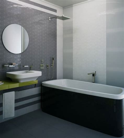 Elegant white and gray bathroom is lit by etoile sconces mounted on either side of a black oblong mirror hung from a wall clad in gray wallpaper over a white beadboard trim lined with a chair rail. Fifty Shades of Grey: Design Ideas and Inspiration