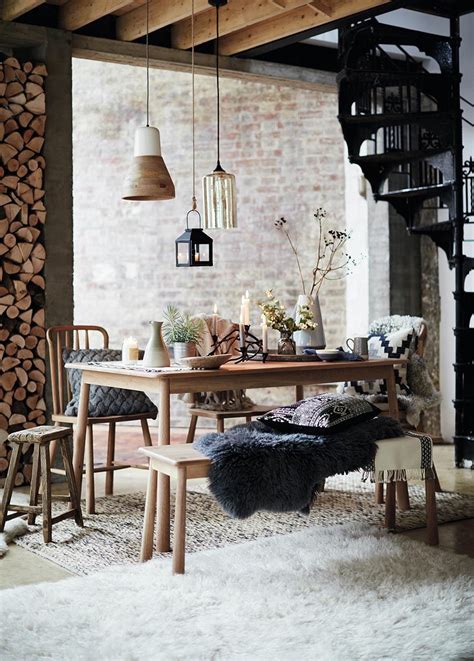 Can You Feel The Hygge A Dining Setup With Lit Candles Fire Logs In A
