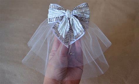 Let your locks flow down to shock the guests with their striking appearance. Shine Trim: Wedding DIY: Two Tier Hair Bow