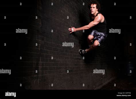Runner Bouncing Off Side Of Wall Stock Photo Alamy