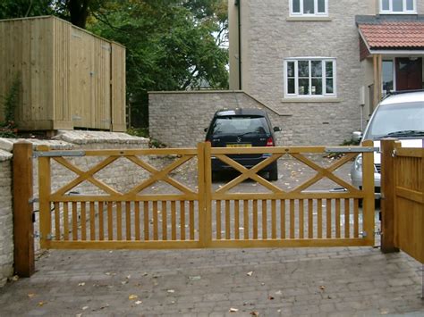 Gates gates that not only enhances the entrance to a property but also offers both privacy and security. The Windsor Range | BG Wooden Gates - Wooden Driveway Gates