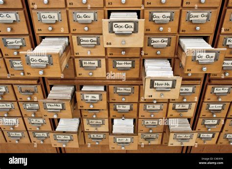 Old Card Catalogue In A Library With Some Drawers Opened Stock Photo