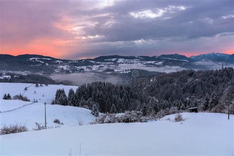 Winter Sunset Over Beautiful Snowy Mountain Landscape In The Alps Stock