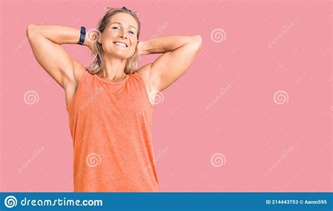 Middle Age Fit Blonde Woman Wearing Casual Summer Clothes And Sunglasses Relaxing And Stretching