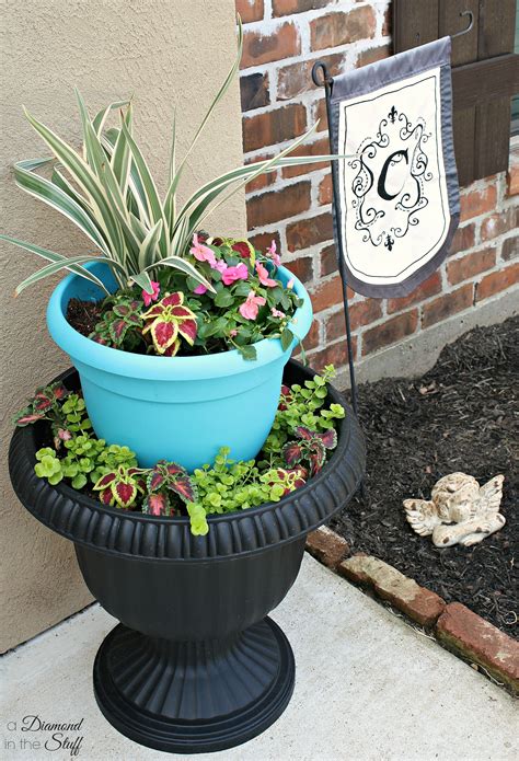 Add the lovely flowers of your chosing and you're done. Tiered Urn Flower Pot