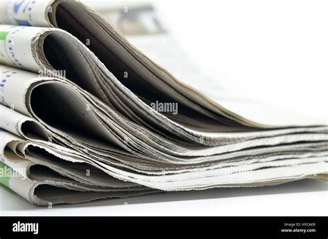 Newspapers Folded And Stacked Isolated On White Stock Photo Alamy