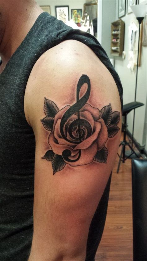 265 awesome music note tattoos (2018 edition) music is the greatest form of expressions, so are tattoos too. Rose and treble clef tattoo, custom designed and executed ...