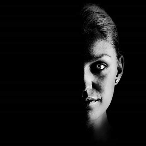 Woman Face In Shadow On Black Banco De Imagens E Fotos De Stock Istock