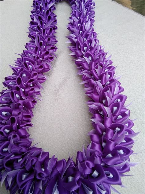 Diy easy lei making for all occasions | garland rosette ideas this is a tutorial on lei making for any occasion. Purple orcid, graduation lei | Graduation leis diy, Graduation leis, Ribbon lei