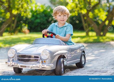 Little Boy Driving Big Toy Old Car Outdoors Stock Photo Image Of