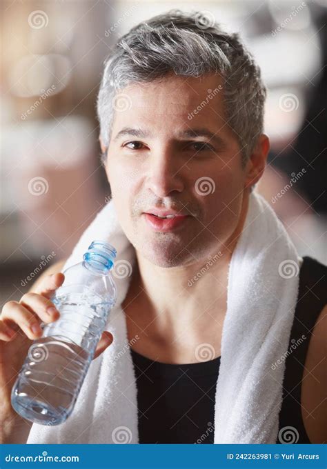 Much Needed Water After A Workout Portrait Of A Mature Man Drinking From A Water Bottle After