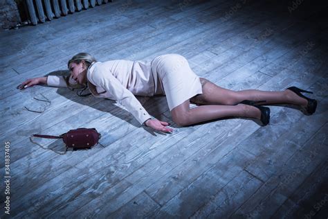 Crime Scene With Strangled Pretty Business Woman Lying On The Floor