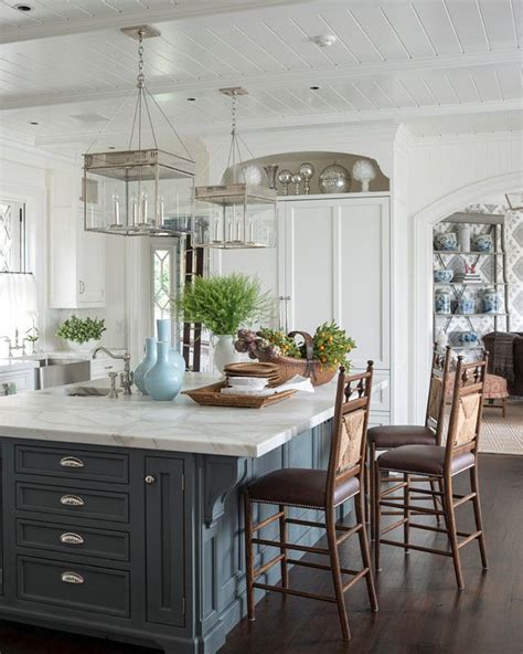 Nantucket kitchen island is constructed of hardwood solids and engineered woods in a sanded and distressed white finish providing an aged worn look. Kitchen island paint color: Farrow & Ball Down Pipe ...