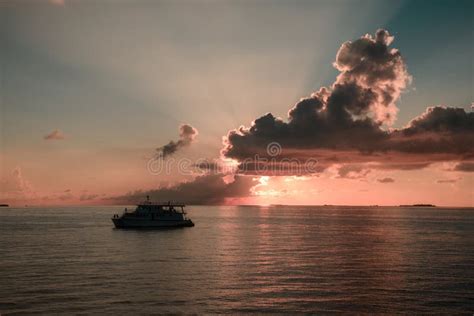 Colourful Sunset In Tropical Islands With Yacht Pink Clouds And Sun