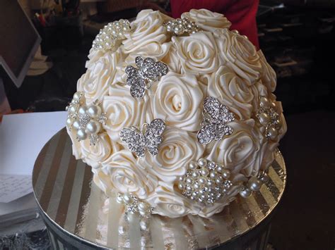 I really love the brooch bouquet trend that is on the rise. Hand made ivory roses with crystal brooches wedding ...