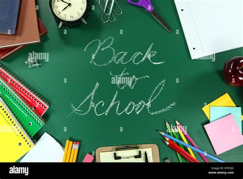 Back To School Supplies On Green Chalkboard Background Stock Photo Alamy