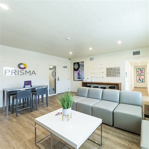 Refrigerator/freezer, stove/oven, microwave, dishwasher, garbage disposal, kitchen table, four dining chairs, cooking utensils, silverware, dinnerware, glasses, pots, pans, and knives living room: Enjoy a private resident lounge at PRISMA Student Housing ...