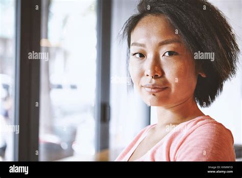 Portrait Of Woman With Nose Piercing In Cafeshanghai French Concession